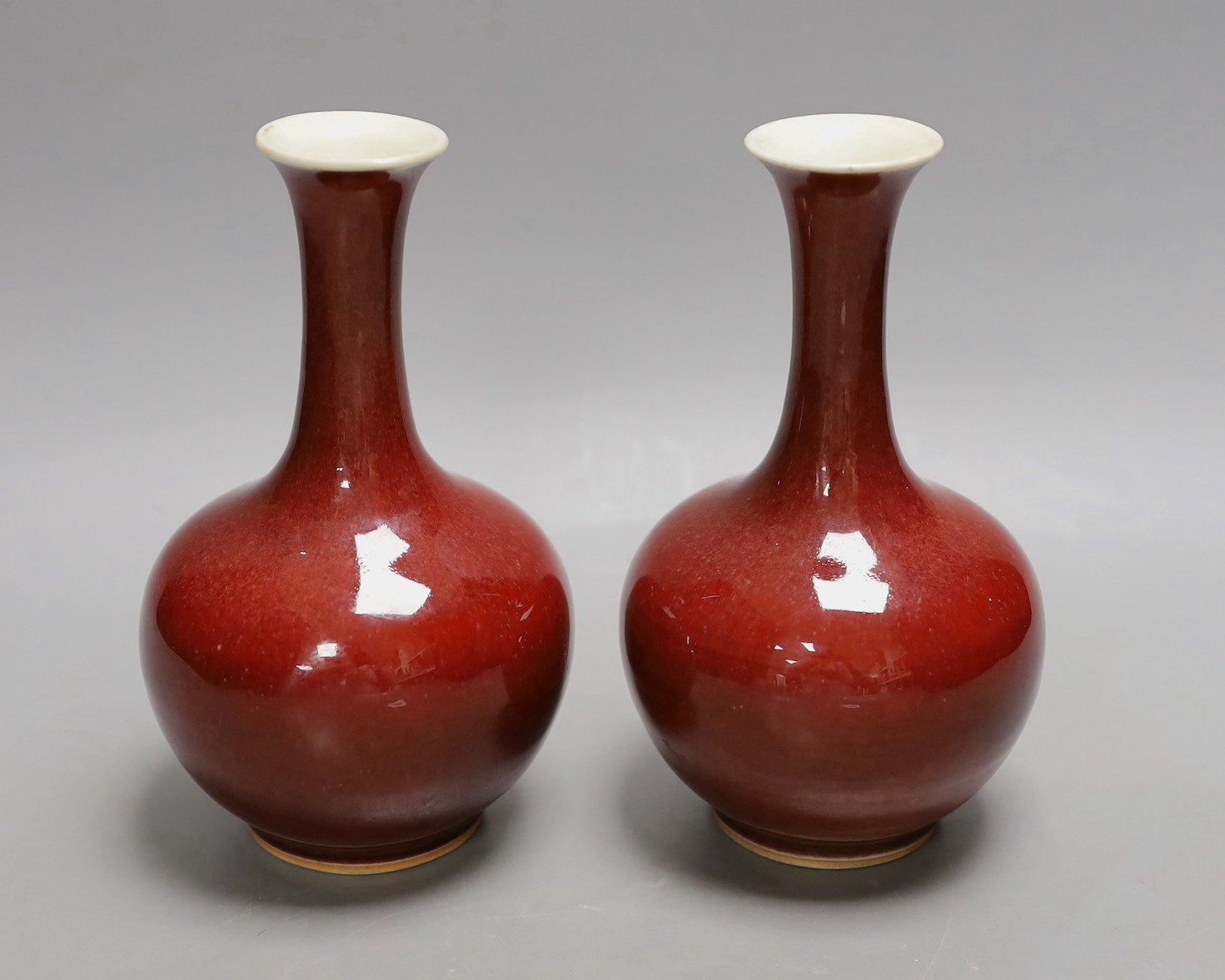 A pair of Chinese sang de boeuf glazed vases, early 20th century, 20cm high